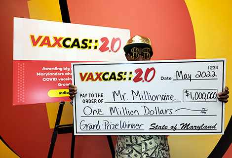 Still in disbelief, “Mr. Millionaire” celebrates his $1 million VaxCash 2.0 grand prize.