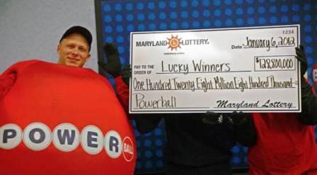 photo of winners with lottery claim check